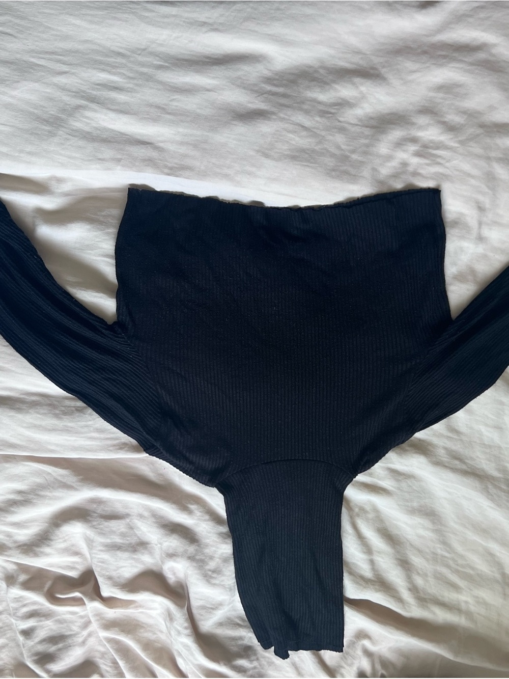 Joah Brown black turtleneck with thumb holes raw edges